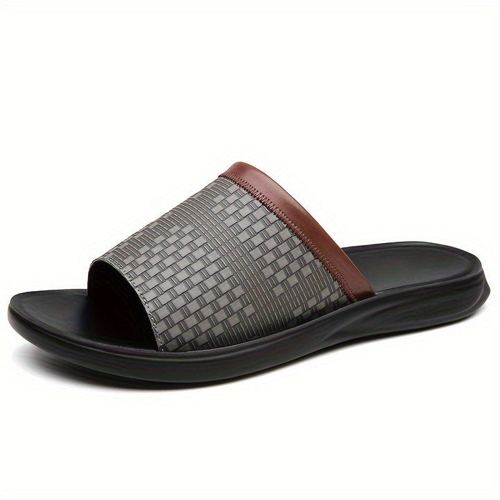 Men's sophisticated textured slide sandals. Comfortable, open-toe design, great for summer, beach, and casual wear.