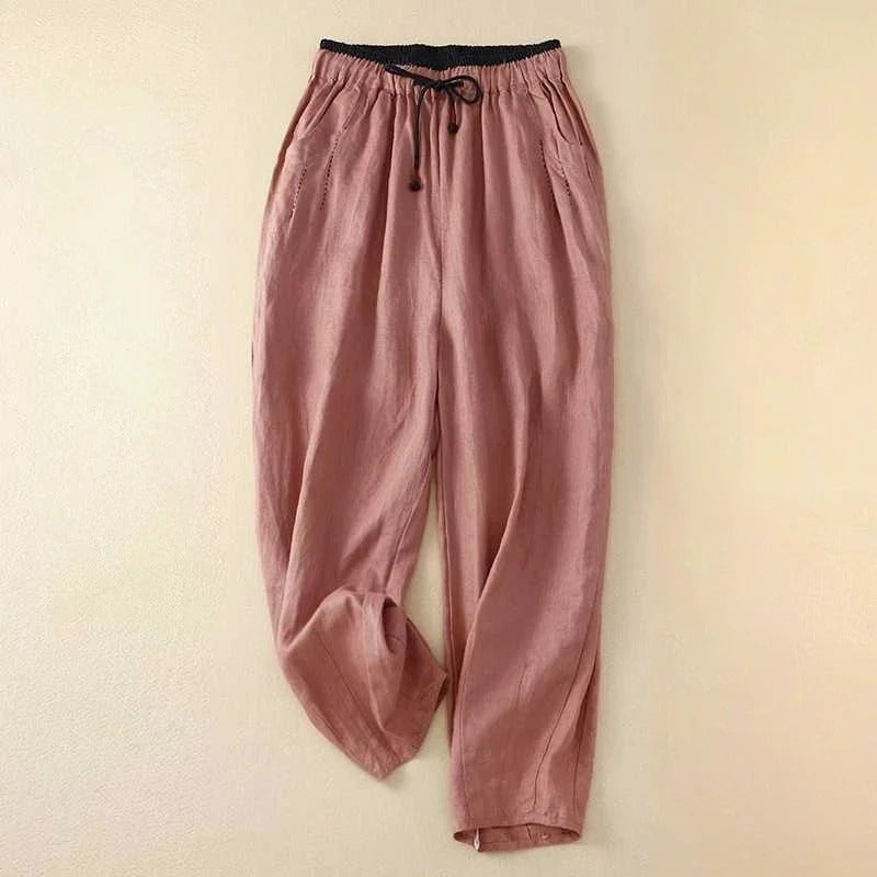 Flowy women's summer pants with an elastic waist, offering a comfortable relaxed fit for warm weather and beach trips.