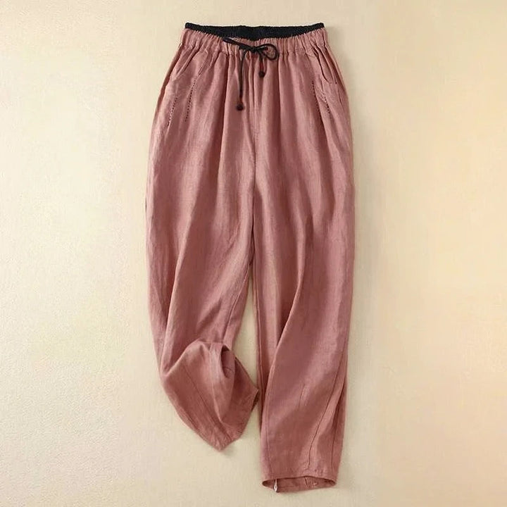 Flowy women's summer pants with an elastic waist, offering a comfortable relaxed fit for warm weather and beach trips.