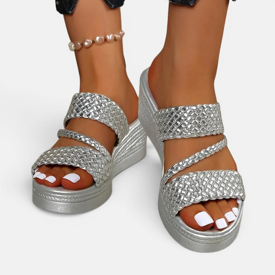 Side view of trendy women's Ainsley platform slip-on sandal, emphasizing height and comfort padding.
