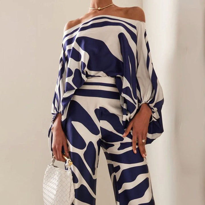 Stylish women's coordinated off-shoulder two-piece set, featuring a chic print & lantern sleeves.