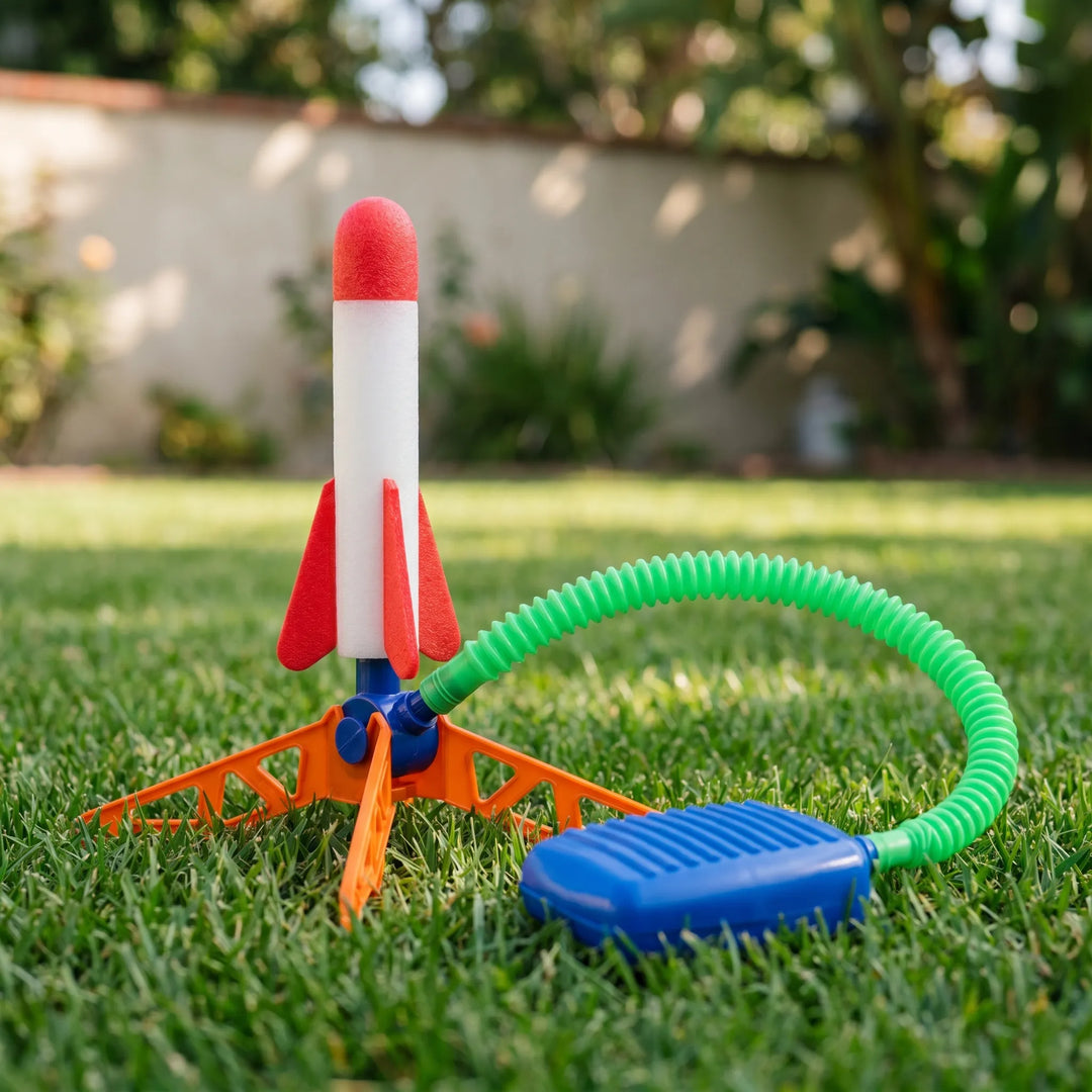 Kids launching an air powered rocket toy with a stomp launcher, perfect for active outdoor play & family fun.