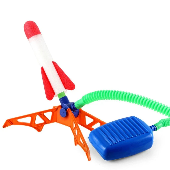 Happy kids enjoying an air powered rocket, a fantastic outdoor toy for active family fun and play.