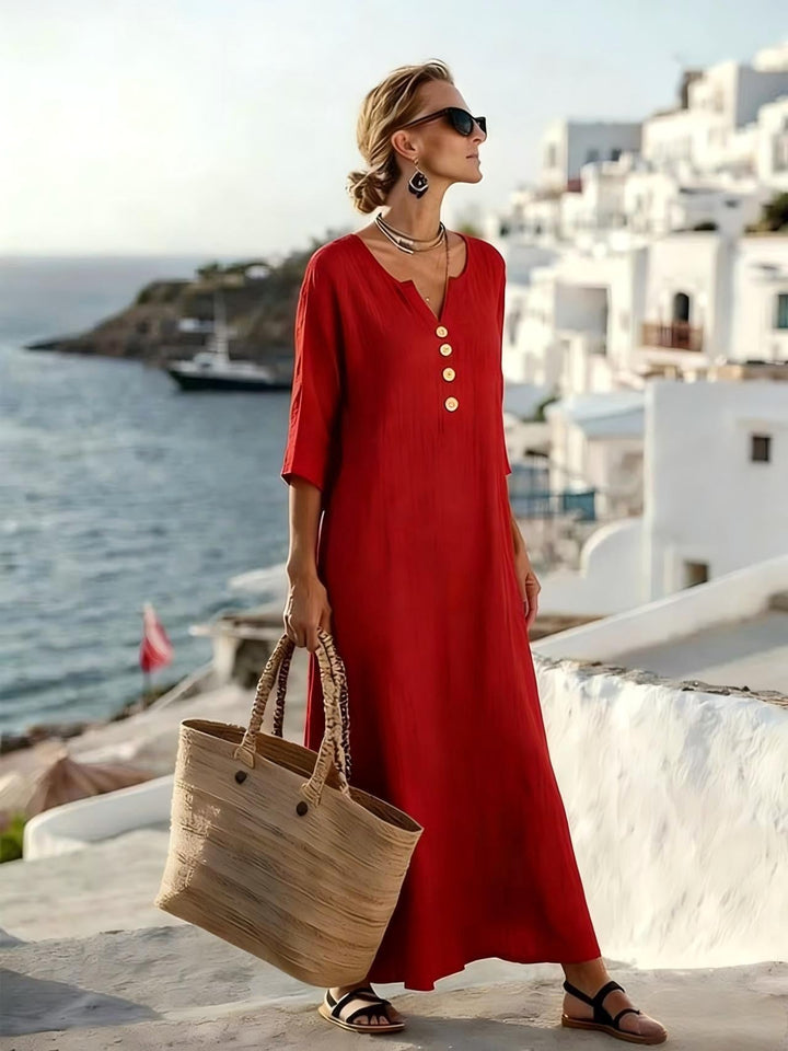 Women's casual button-down shirt dress with three-quarter sleeves, ideal for versatile summer styling.