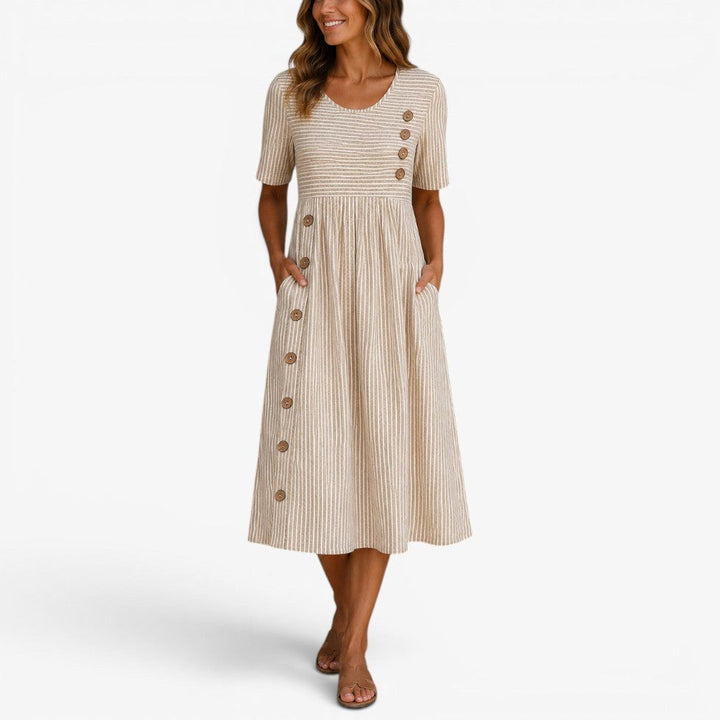 Women's relaxed striped midi dress with elegant front buttons, perfect for casual summer wear.