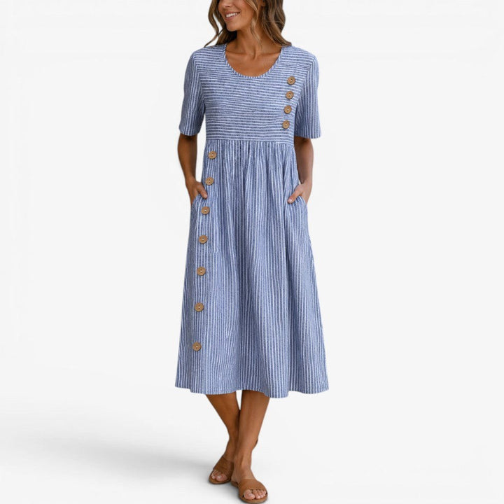 Comfortable women's relaxed fit striped midi dress with chic button details, perfect for flowy summer fashion.
