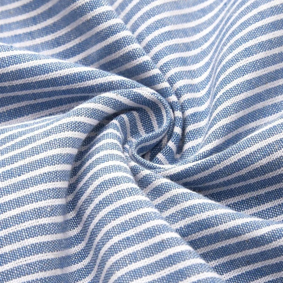 Casual elegant women's striped midi dress featuring a relaxed fit and delicate button detailing, ideal for summer.