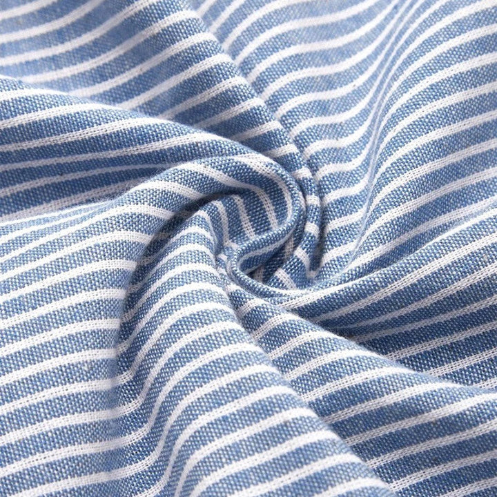 Casual elegant women's striped midi dress featuring a relaxed fit and delicate button detailing, ideal for summer.