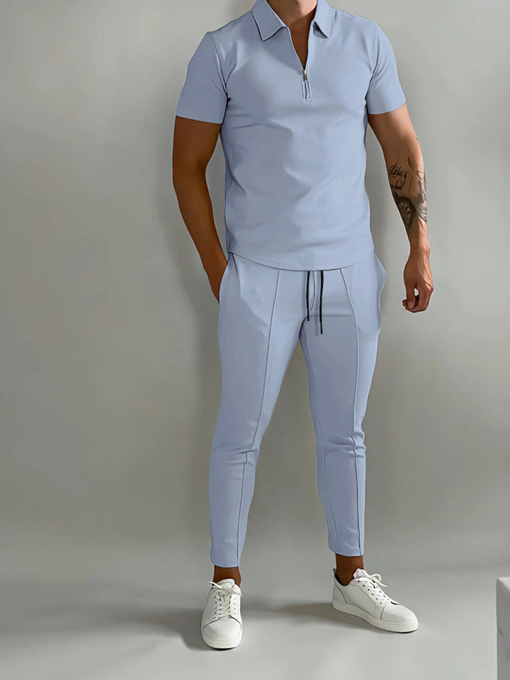 Effortless style with this men's two-piece polo shirt and pants set. Versatile for casual or active wear.