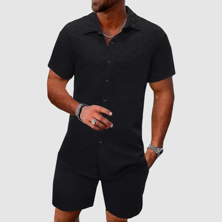 Stylish men's casual shirt & shorts combo. This button-down set is a trendy summer outfit for warm weather days.