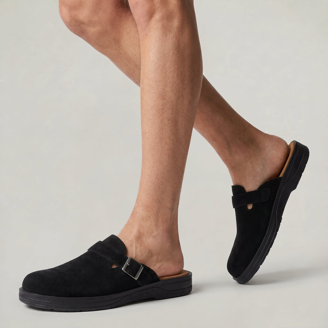 Stylish men's buckle strap clogs offering refined slip-on comfort. Casual mules for versatile men's everyday fashion.