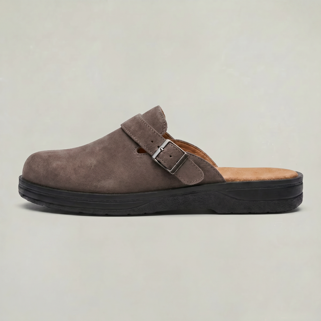 Men's refined slip-on clogs feature a secure buckle strap for a comfortable fit, perfect for casual men's fashion.