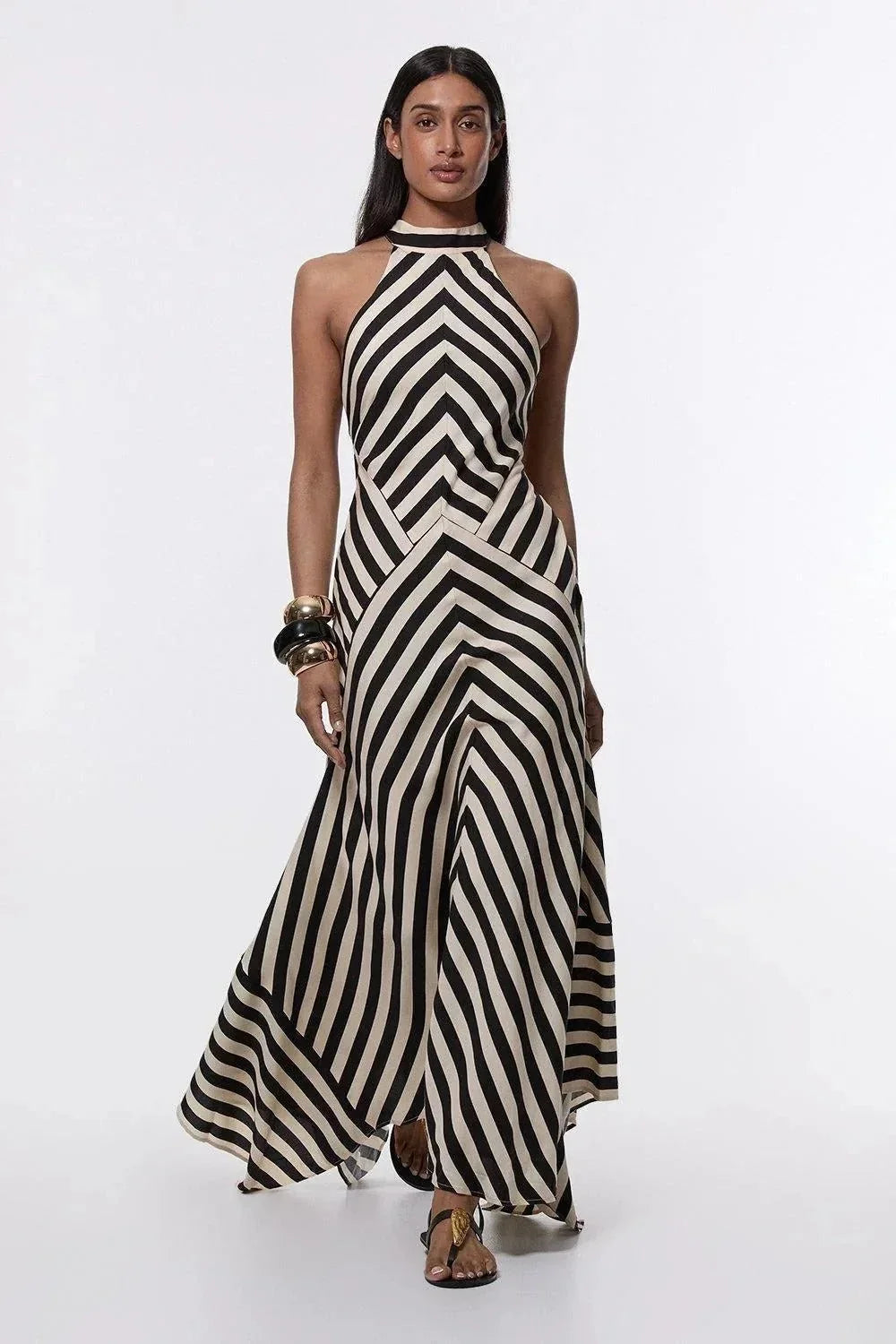 Elegant women's halter maxi dress with chic chevron stripes & stylish open back, ideal for formal occasions.