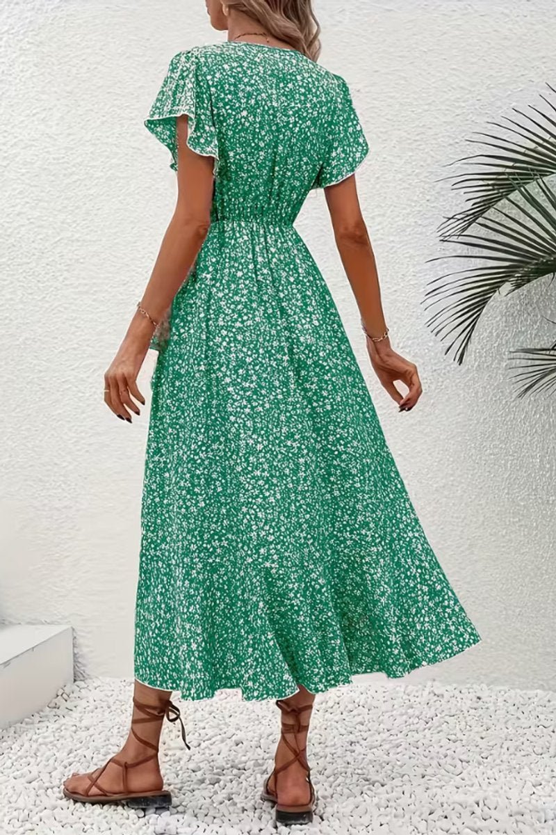Feminine floral wrap midi dress with charming flutter sleeves, great for any party.