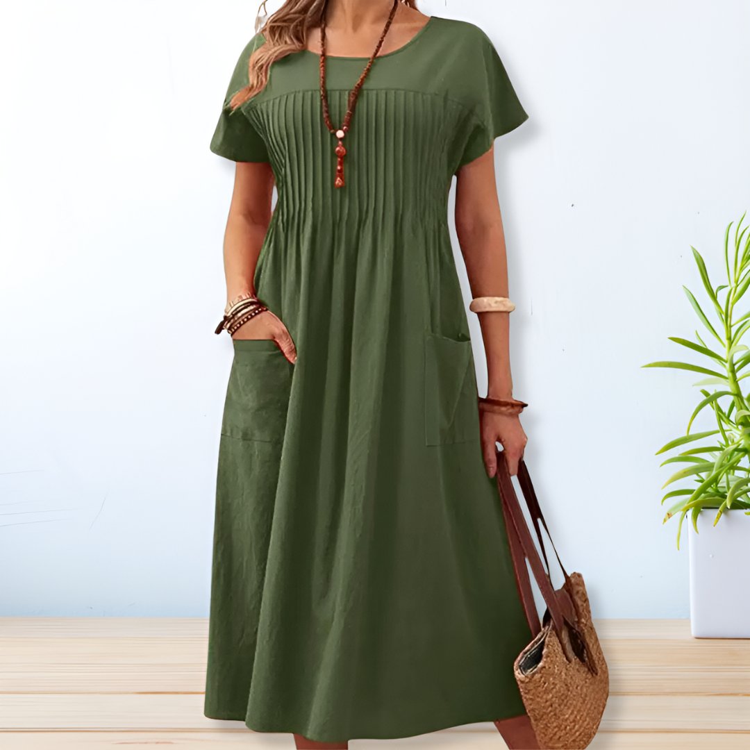 Comfortable women's short sleeve midi dress with pockets. A versatile relaxed fit day dress for everyday style.