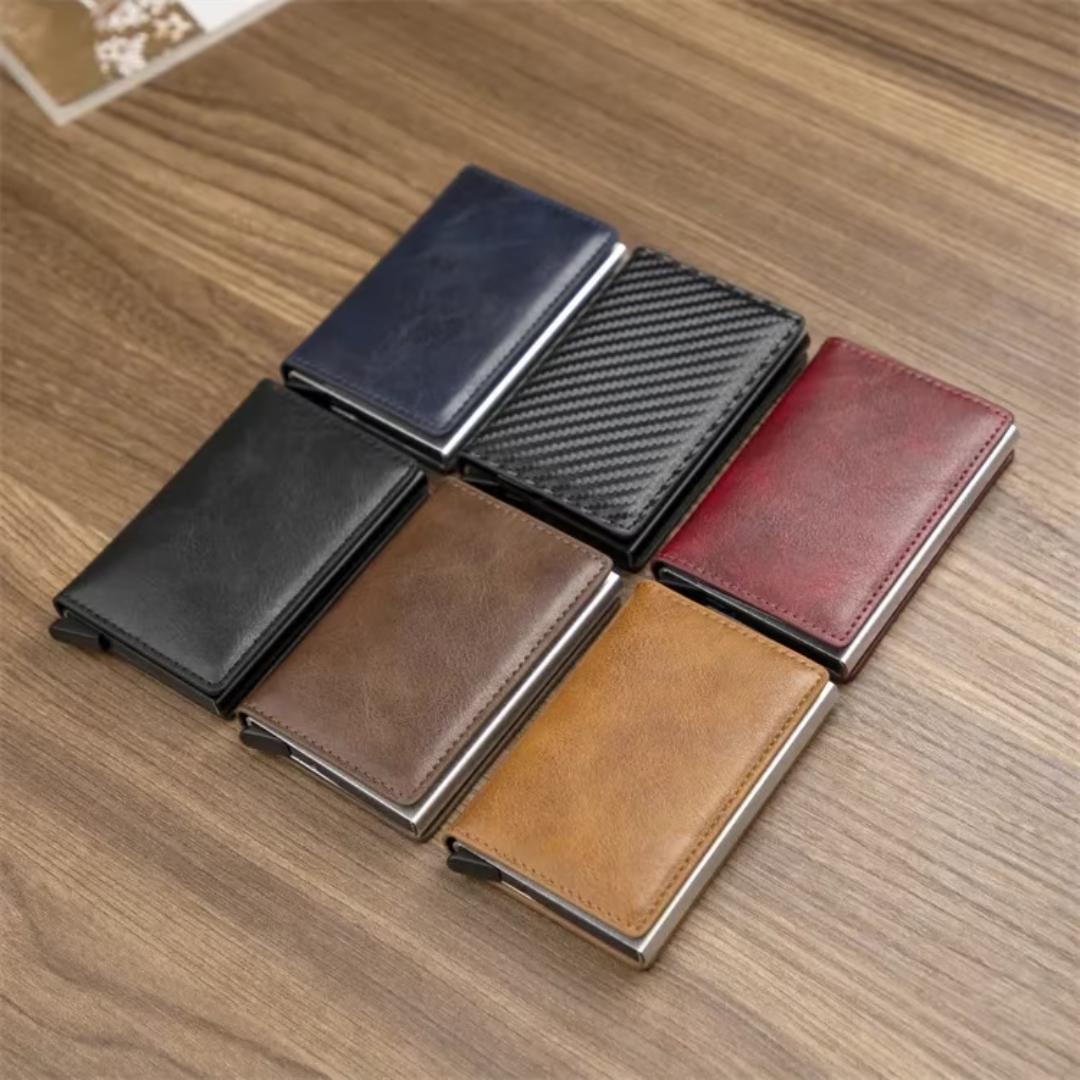 Hand holding a men's aluminum RFID credit card holder wallet with a money clip.