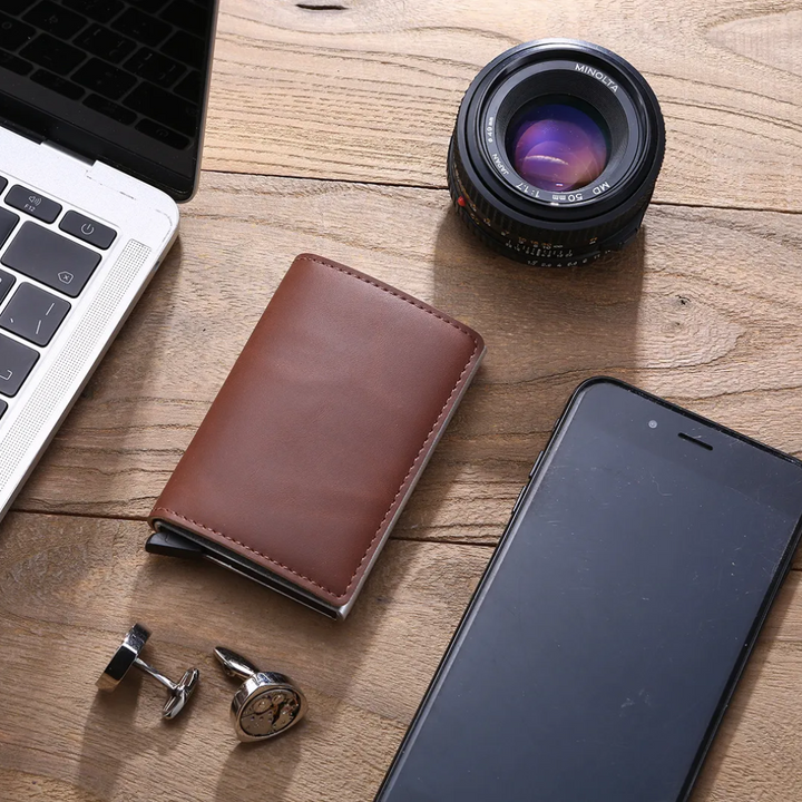 Close-up of the secure metal money clip on a men's aluminum cardholder wallet.