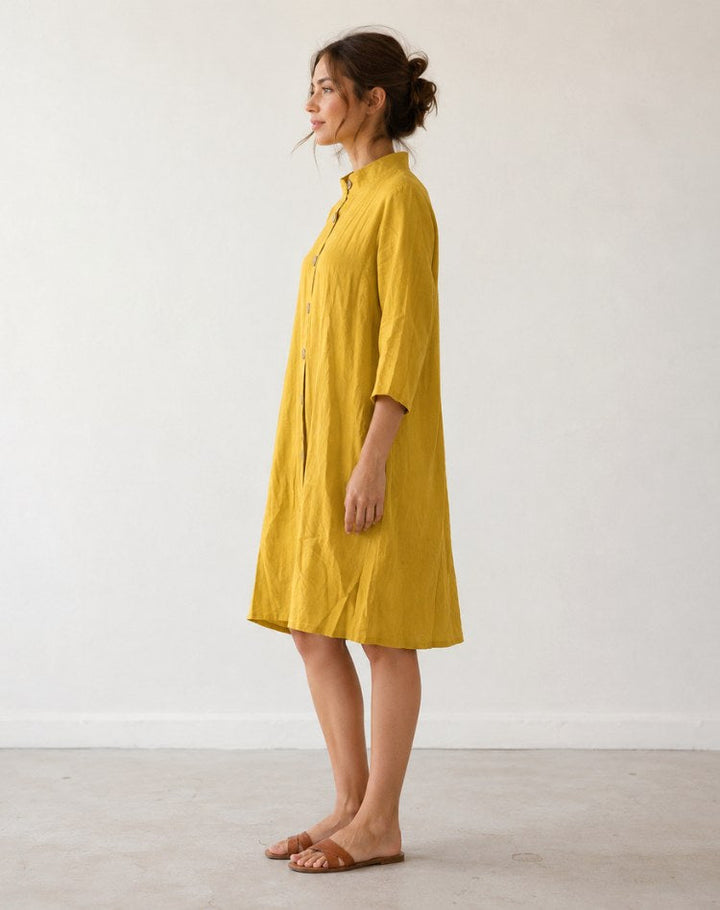 Effortless women's relaxed collar midi dress with full button-front, perfect for comfortable and stylish daytime wear.