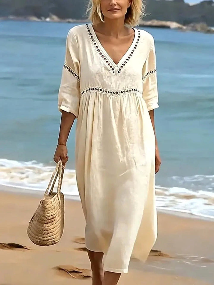 Comfortable women's fluid v-neck midi dress, an elegant and versatile choice for spring and summer style.