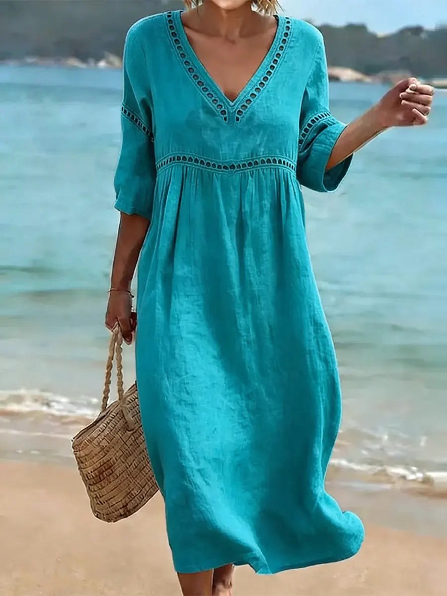 Stylish women's fluid v-neck midi dress, offering effortless elegance for everyday wear or summer events.