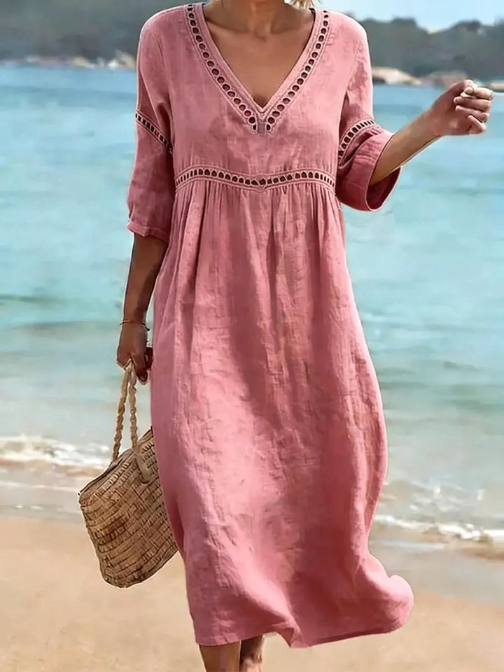 Elegant women's flowy v-neck midi dress, designed for comfortable, versatile spring and summer fashion.