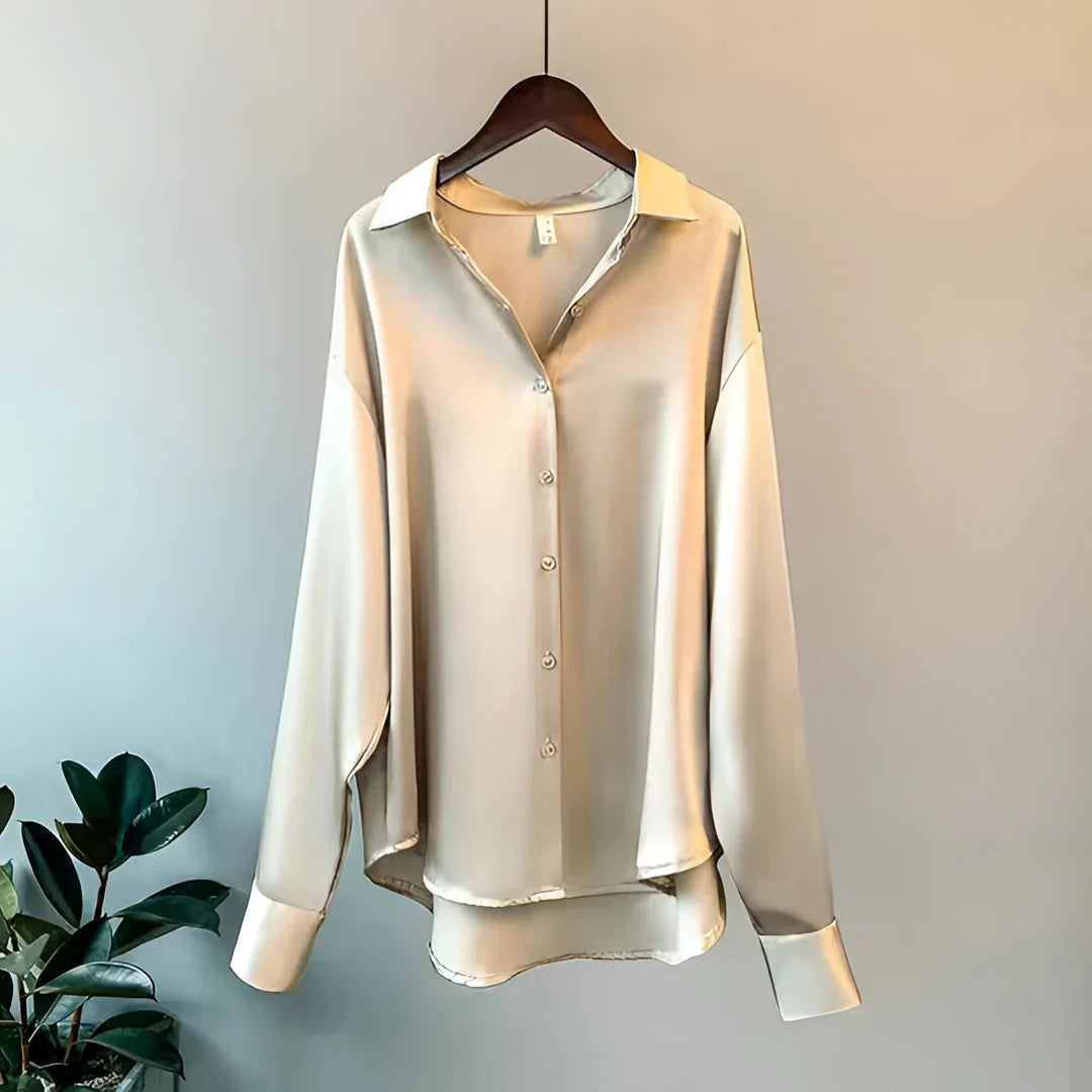 Elegant women's button-up blouse, long sleeve, collared, perfect for office or sophisticated evening wear.
