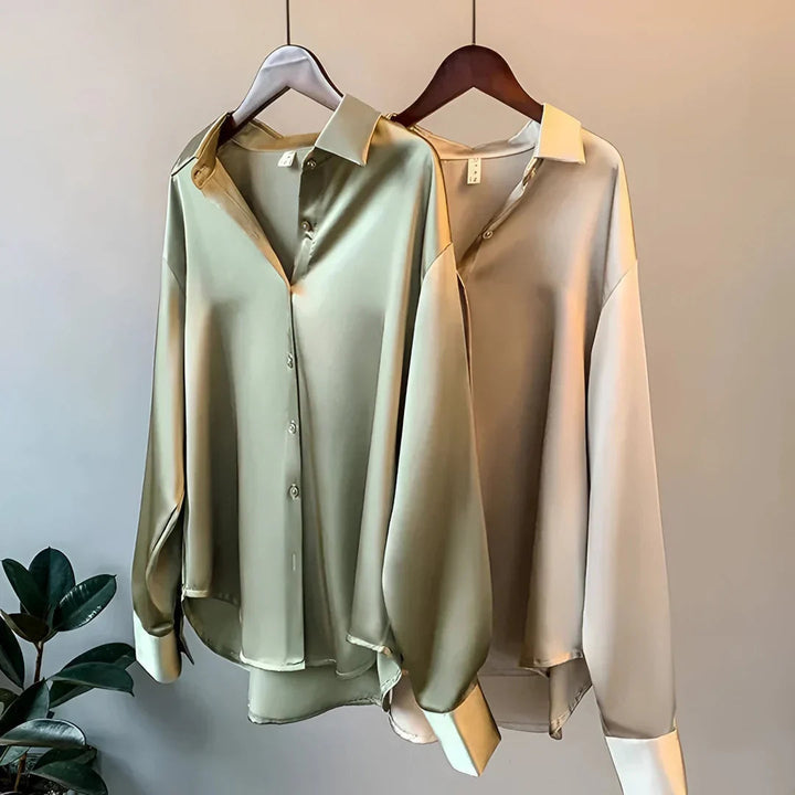 Sophisticated women's long-sleeve collared blouse, button-up, professional office wear or elegant occasion.