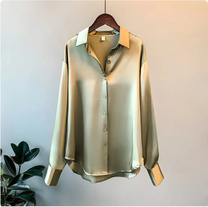 Chic women's button-up blouse, long sleeves, collared design. Elegant top for office, professional, or evening.
