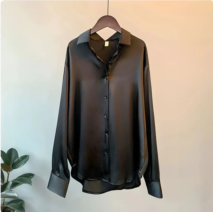 Women's sophisticated button-up blouse, long sleeve, collared, relaxed fit, perfect for professional or evening.