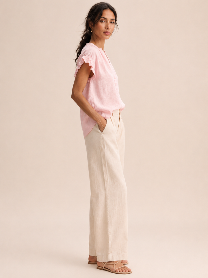 Versatile pink women's top with V-neckline and cute cap sleeves for summer fashion.