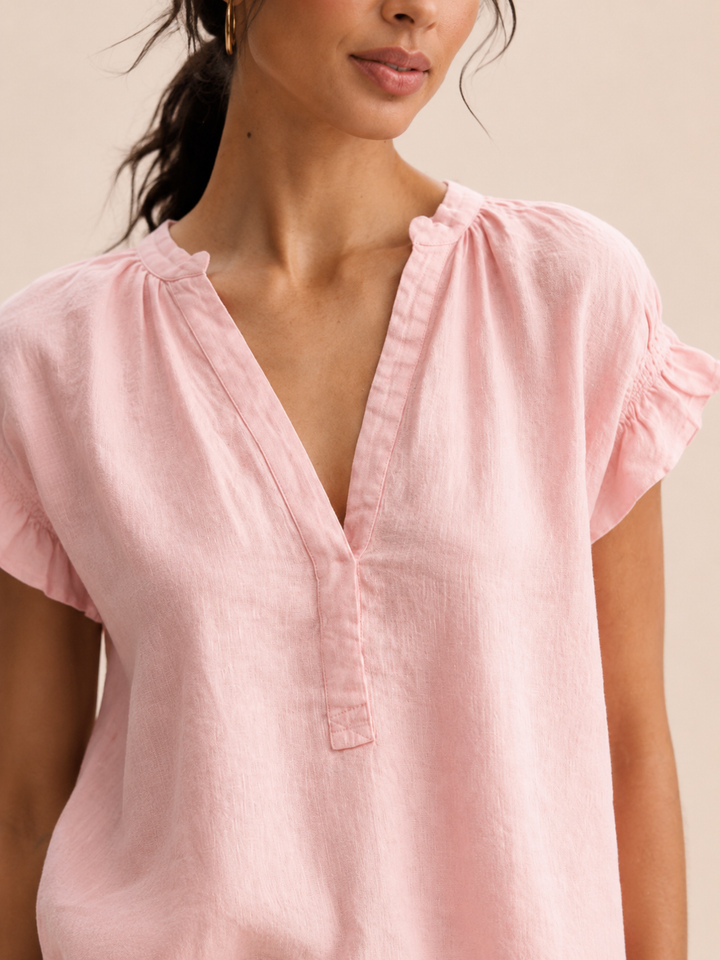Timeless beige V-neck blouse with ruffle sleeves, a relaxed fit top for everyday wear.