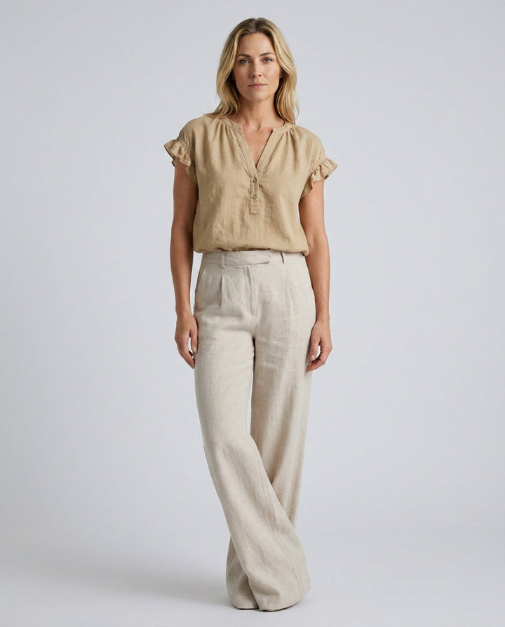 Pink V-Neck Blouse with elegant ruffle cap sleeves, a versatile top for spring and summer.