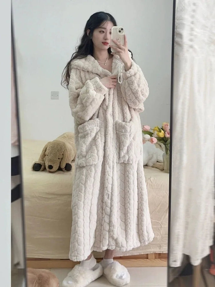 Soft and warm women's Amy Nightfall bathrobe featuring a comfortable hood, perfect for home wear.