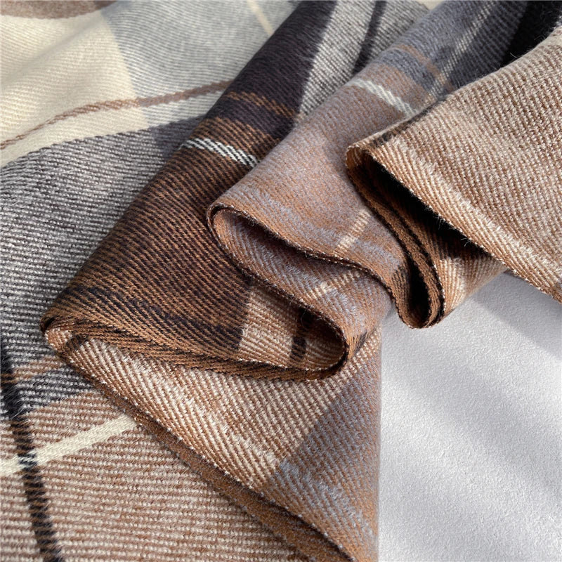 Soft knitted checkered scarf, a trendy and warm women's winter fashion statement.
