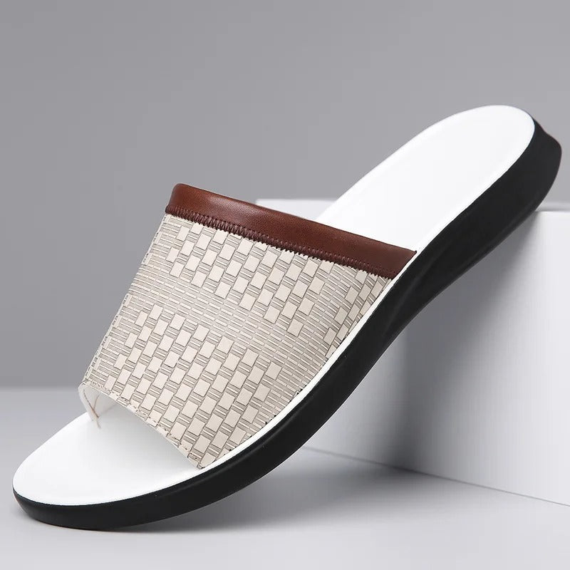 Men's black woven slip-on slides by the pool, comfortable summer footwear for relaxation.