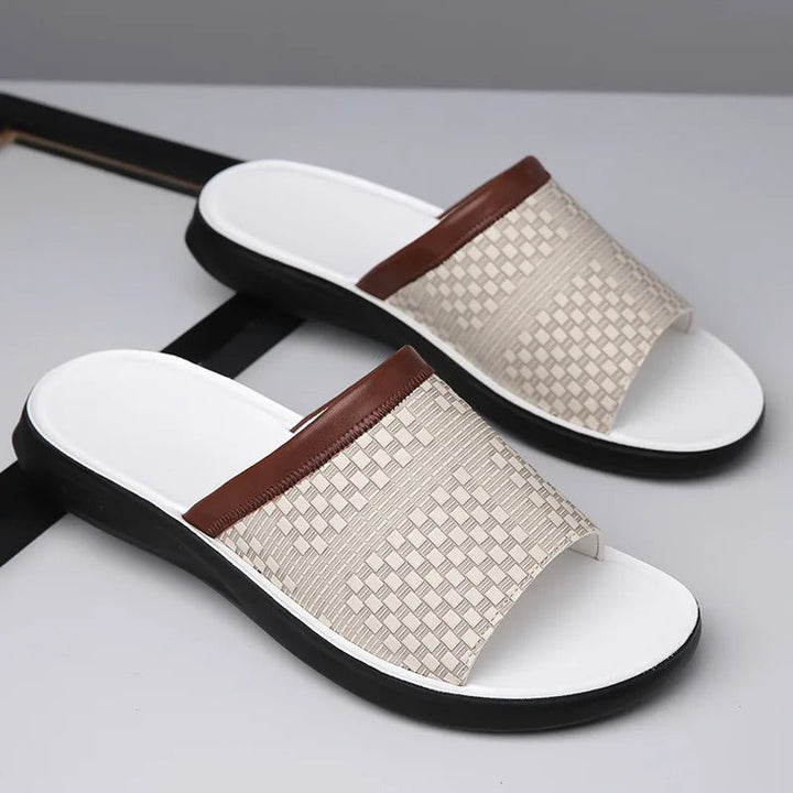 Man walking in stylish brown woven slip-on slides, perfect casual footwear for city summer.
