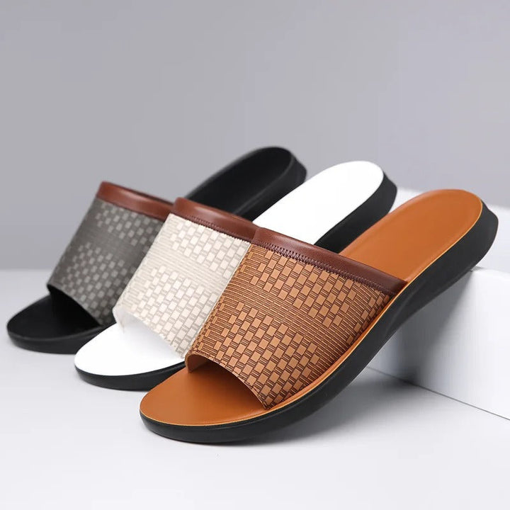 Graceful men's brown woven slip-on slides, adding effortless style to any casual summer outfit.