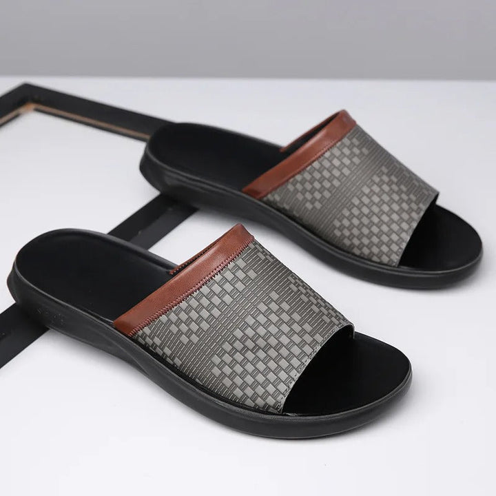 Side view of men's casual black woven slip-on slides, perfect for summer effortless style.
