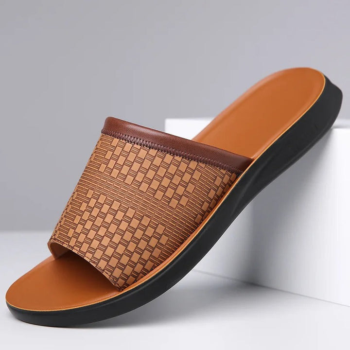 Clean white men's woven slip-on slides for effortless summer style and comfort.