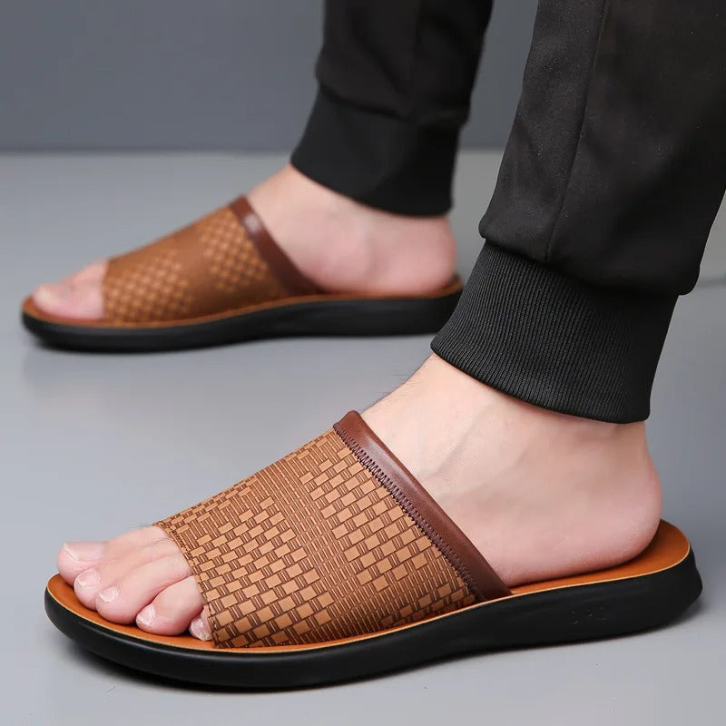 Angled view of elegant brown men's woven slip-on slides, casual summer footwear.