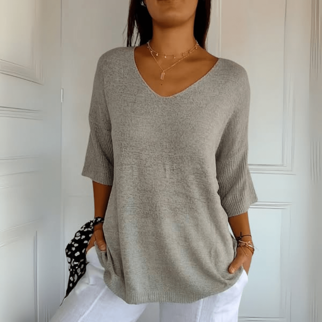 Relaxed women's v-neck knit sweater, a comfortable top with three-quarter sleeves for spring.
