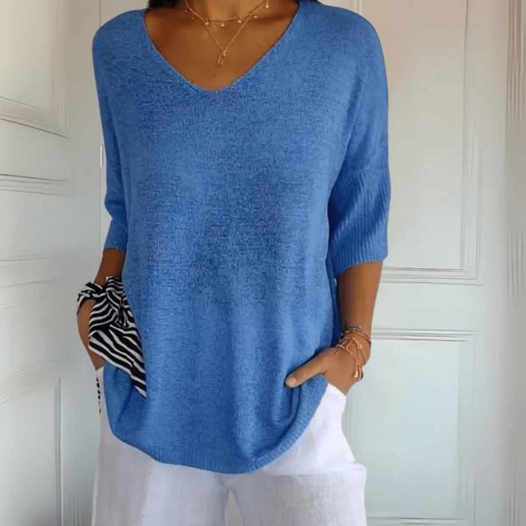 Stylish women's v-neck sweater, a versatile loose knit top with three-quarter sleeves for spring.