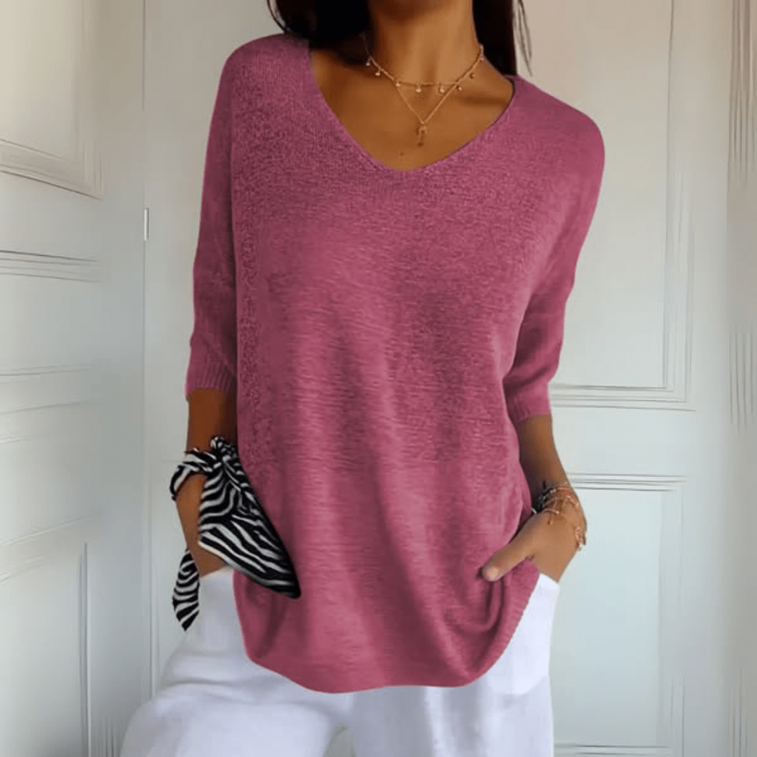 Loose fit women's v-neck sweater, a casual knit jumper designed for everyday comfort.