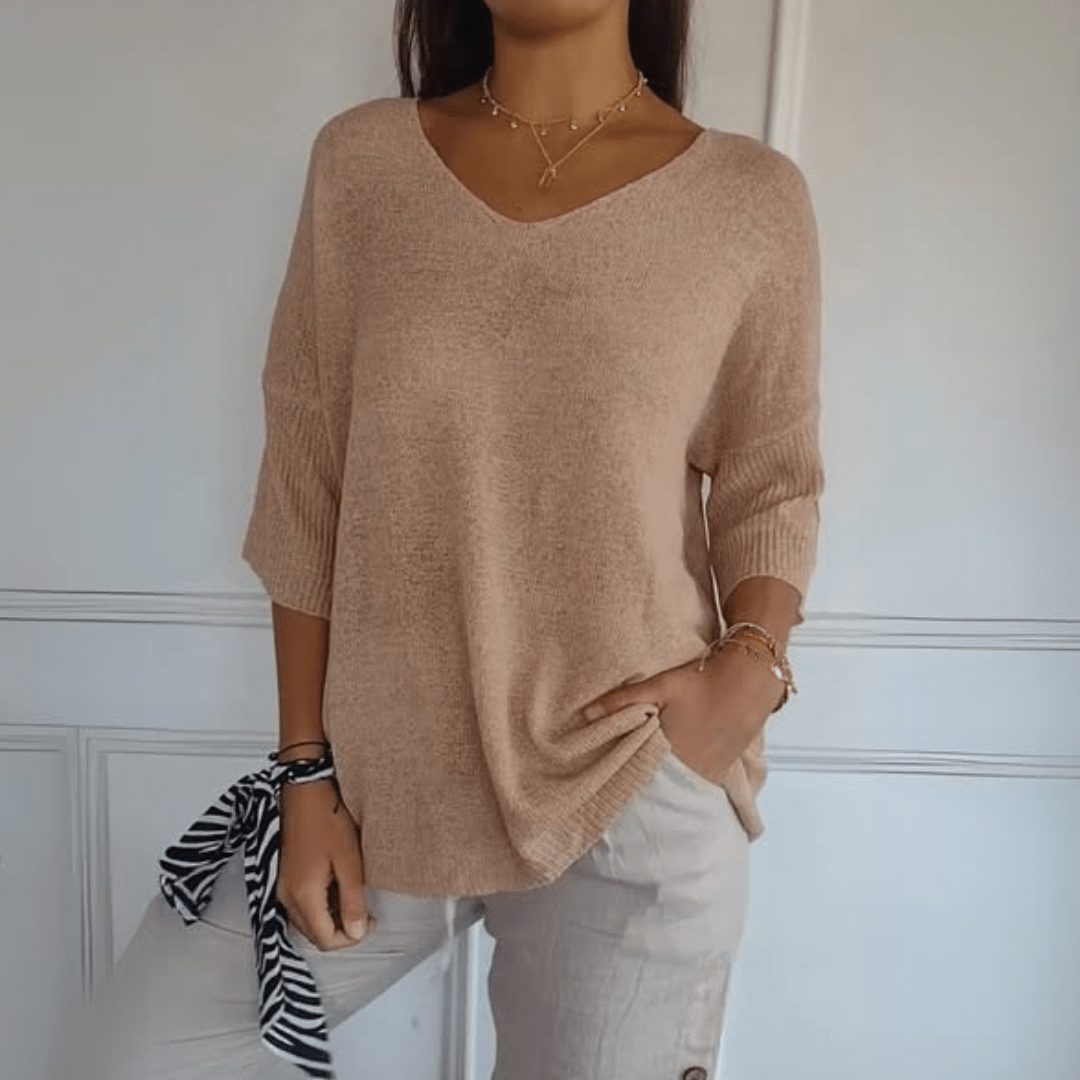 Comfortable women's three-quarter sleeve v-neck sweater, ideal for spring fashion.