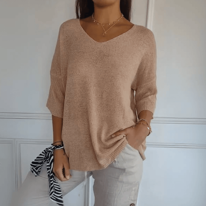 Comfortable women's three-quarter sleeve v-neck sweater, ideal for spring fashion.