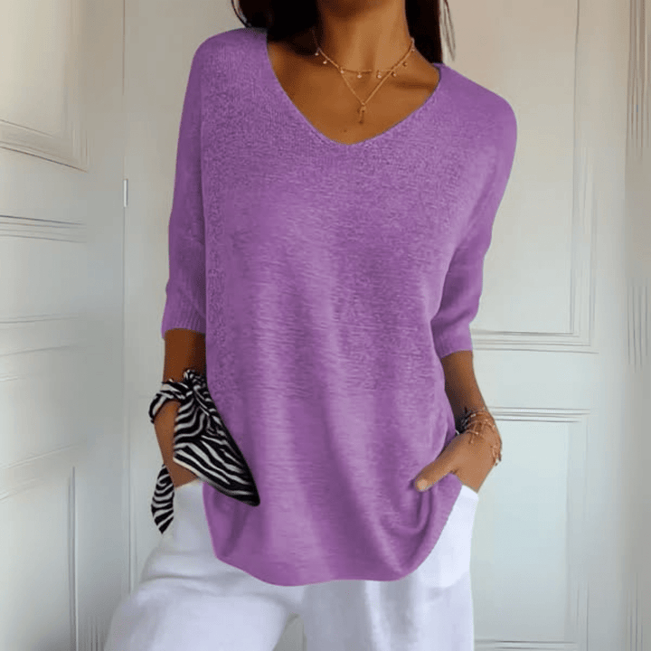 Chic women's loose v-neck knit sweater, perfect for spring fashion and casual outings.