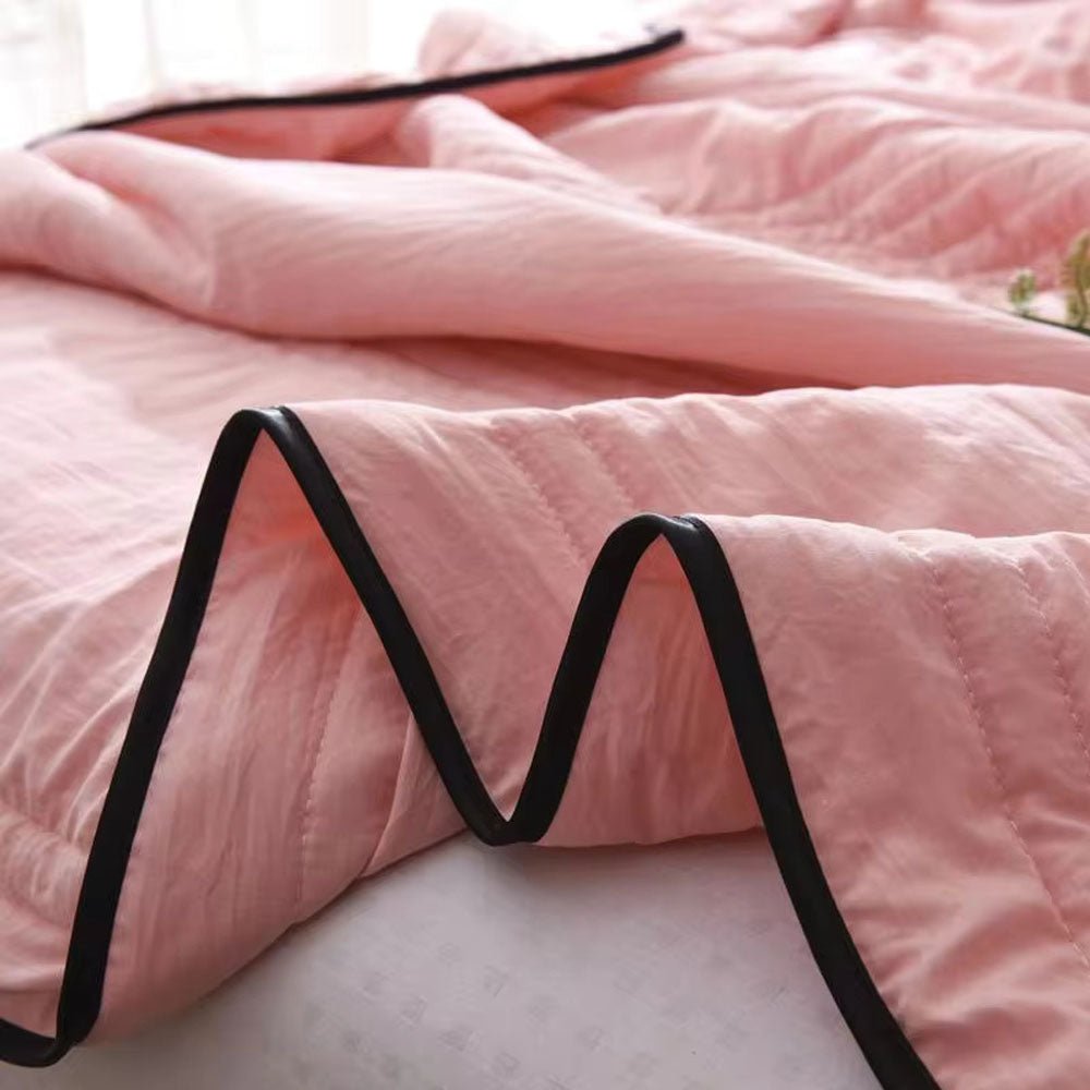 Cooling comfort blanket with a subtle texture, enhancing your home decor and ensuring restful, cool sleep.