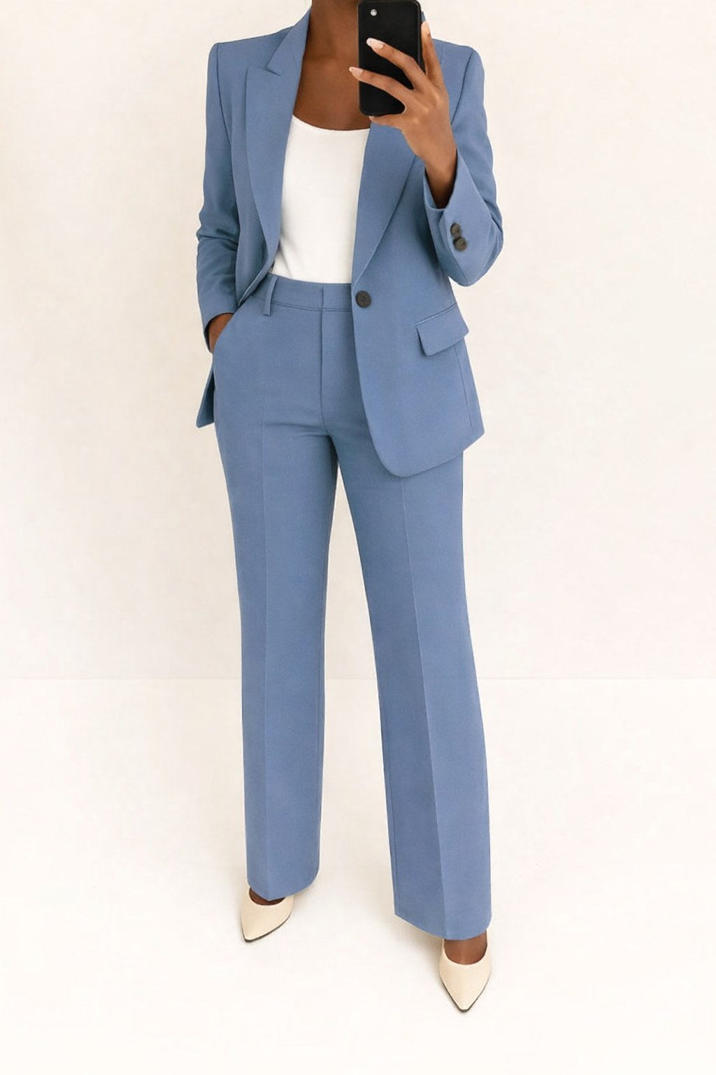 Elegant women's wide-leg structured blazer suit. Two-piece professional trouser set for business casual fashion.