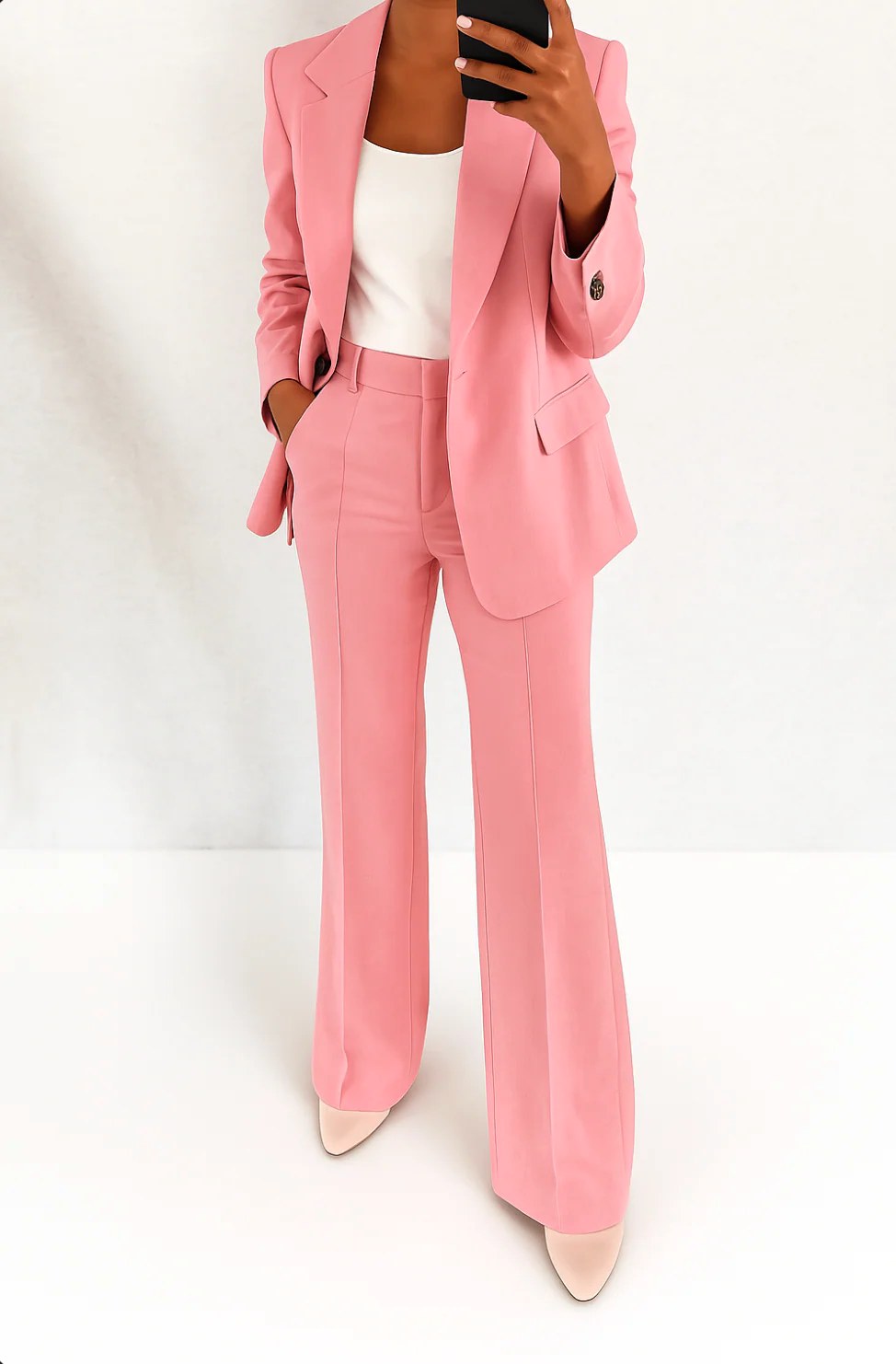 Versatile women's wide-leg trouser suit set. Structured blazer & high-waist pants for elegant business casual style.