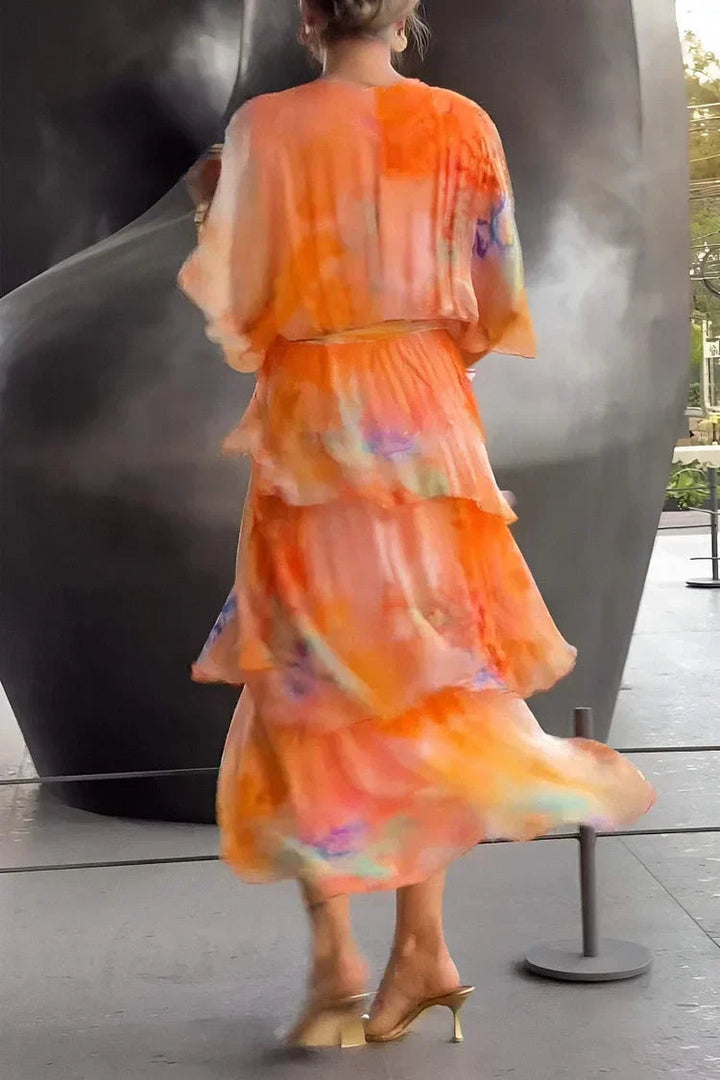 Women's elegant summer maxi dress, featuring tiered ruffles & a wrap design, perfect for garden parties.